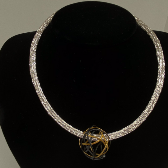 Gold and silver open sphere necklace